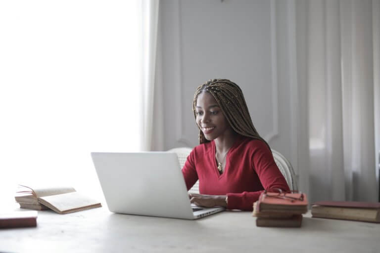 woman-in-red-long-sleeve-shirt-using-macbook-air-3786763 (1)